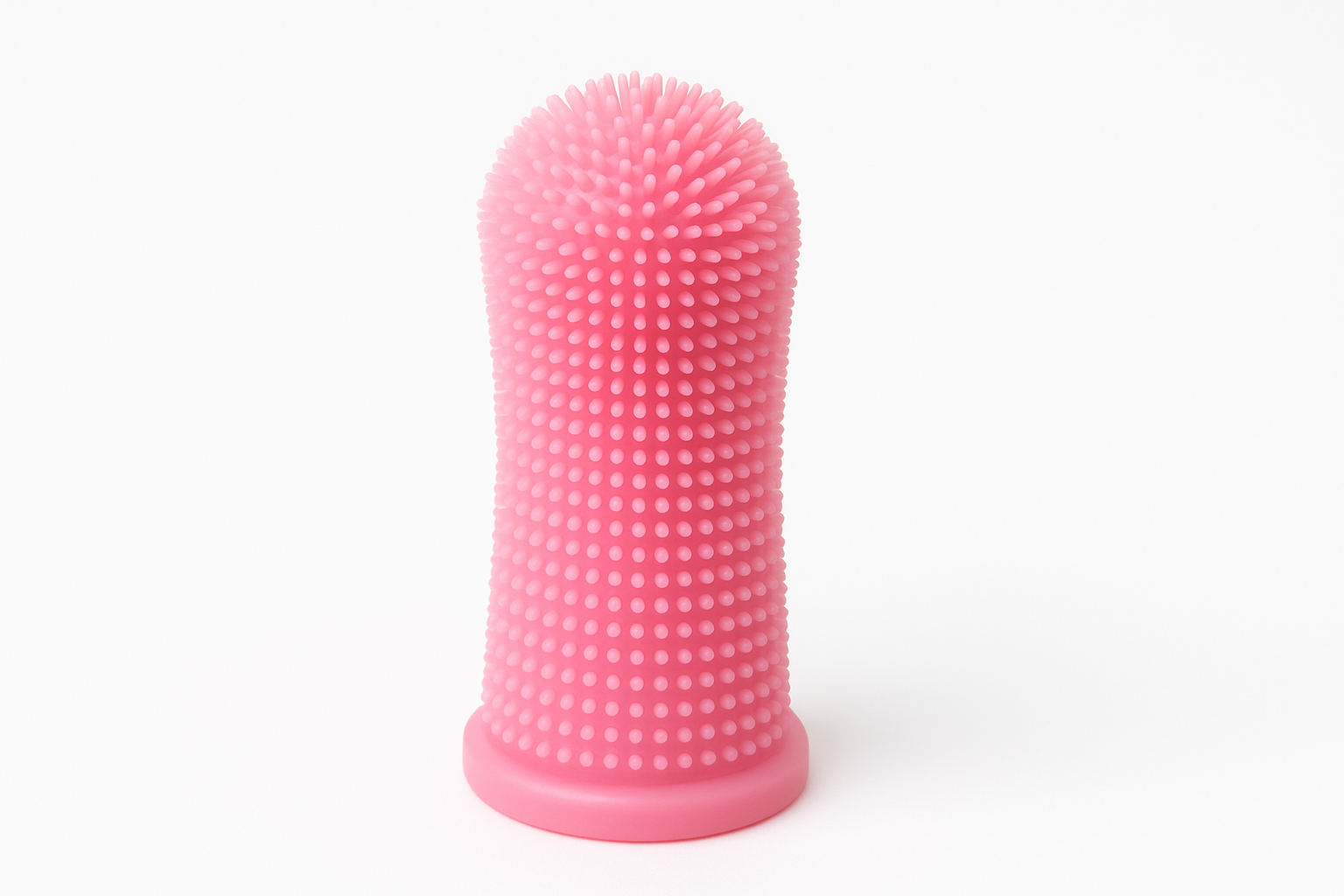 Pink finger toothbrush with white background